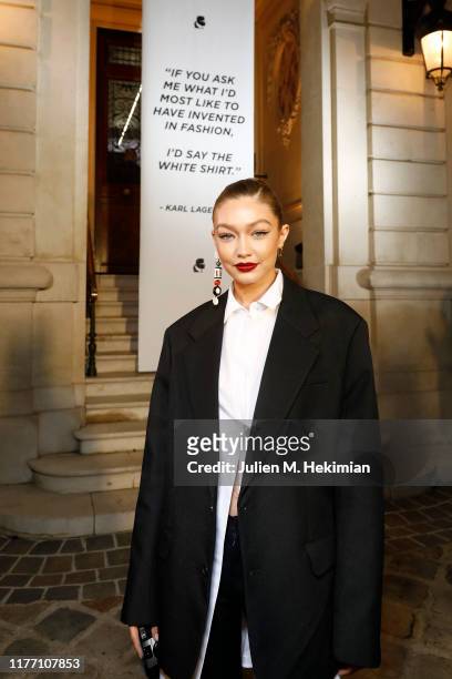 Gigi Hadid attends the “Tribute to the Karl Lagerfeld: The White Shirt Project” exhibition as part of Paris Fashion Week in Paris on September 25,...