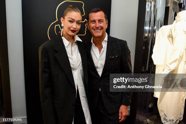 Gigi Hadid and Pier Paolo Righi attend the “Tribute to the Karl Lagerfeld: The White Shirt Project” exhibition as part of Paris Fashion Week in Paris...