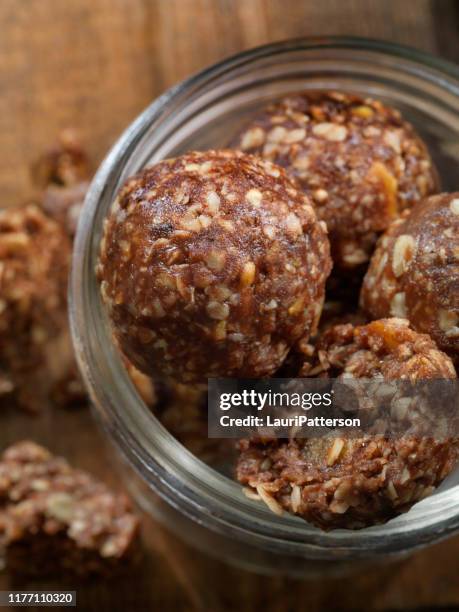 cocoa and oat energy balls - nut butter stock pictures, royalty-free photos & images