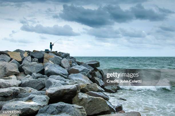 fishing, the fort lauderdale beach jetties, fort lauderdale, florida - fort lauderdale florida ストックフォトと画像