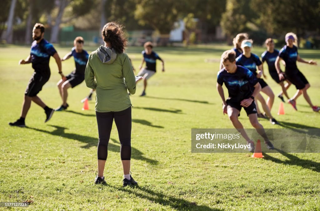 Coach paying attention on team training