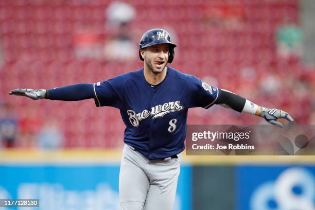 Ryan Braun of the Milwaukee Brewers reacts after hitting a grand slam home run in the first inning against the Cincinnati Reds at Great American Ball...