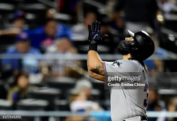 Jorge Alfaro of the Miami Marlins celebrates a home run in the ninth inning of their game against the New York Mets at Citi Field on September 25,...