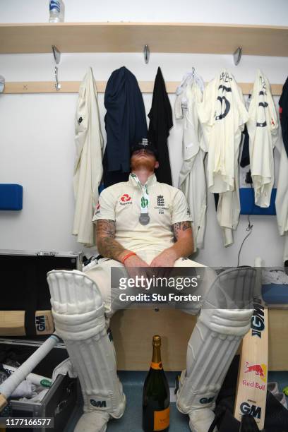 England batsman Ben Stokes takes a moment to reflect in the dressing room after hitting 135 not out to win the match for England by 1 wicket after...