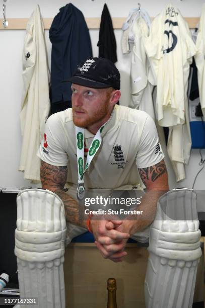 England batsman Ben Stokes takes a moment to reflect in the dressing room after hitting 135 not out to win the match for England by 1 wicket after...