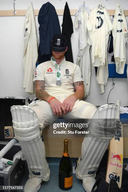 England batsman Ben Stokes takes a moment to reflect in the dressing room after hitting 135 not out to win the match for England by 1 wicket after...