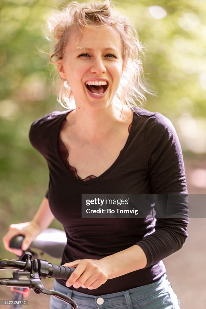 Young woman with her bicycle