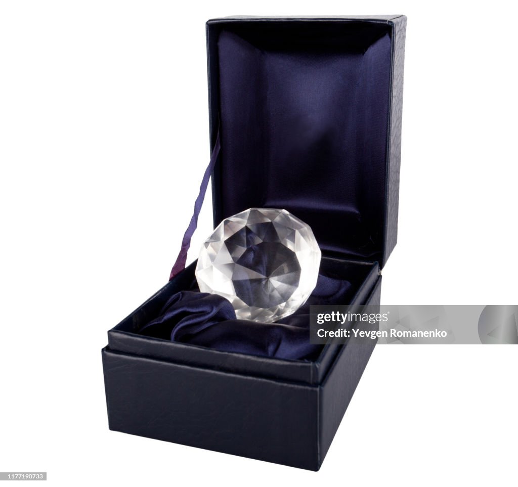 Diamond in a box isolated on white background