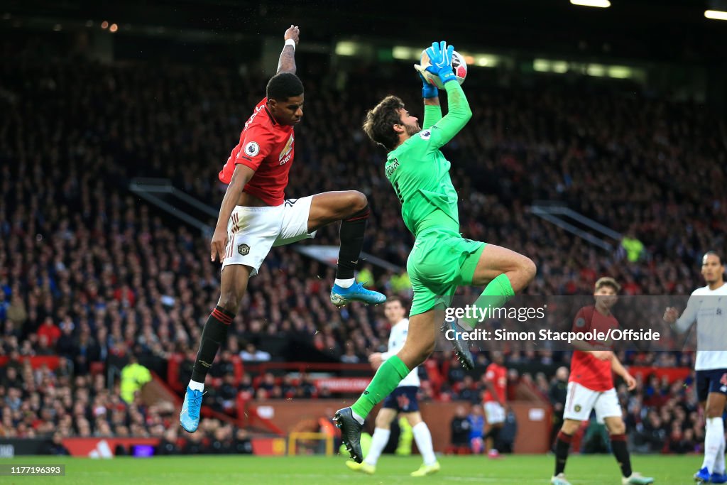 Ivfa Liverpool Liverpool goalkeeper Alisson Becker makes a save in front of Marcus ...