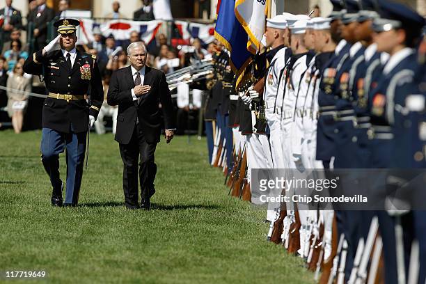 United States Secretary of Defense Robert Gates inspects soldiers, airmen, Marines, sailors and guardsmen during his Armed Forces Farewell Tribute on...
