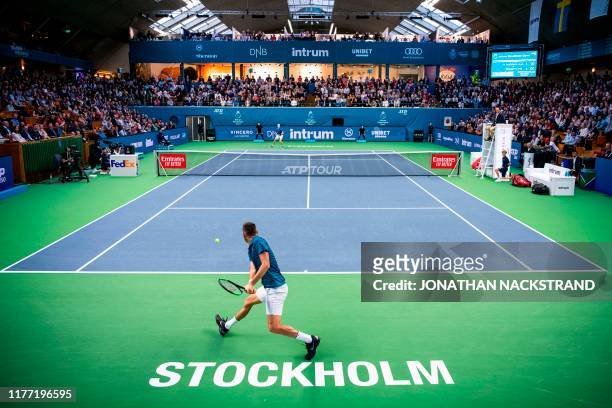 Serbias Filip Kranjinovic returns the ball to Canadas Denis Shapovalov during the final match of the ATP Stockholm Open tennis tournament in...