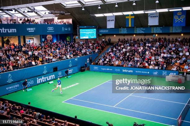 Canadas Denis Shapovalov returns the ball to Serbias Filip Kranjinovic during the final match of the ATP Stockholm Open tennis tournament in...