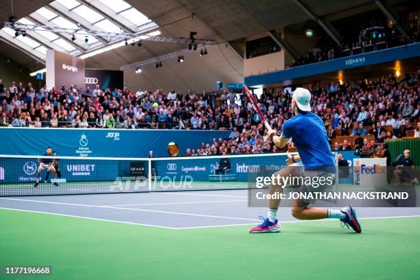 Canadas Denis Shapovalov returns the ball to Serbias Filip Kranjinovic during the final match of the ATP Stockholm Open tennis tournament in...