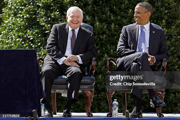 United States Secretary of Defense Robert Gates and President Barack Obama share a laugh during Gates' Armed Forces Farewell Tribute on the River...