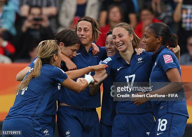 Gaetane Thiney of France celebrates her goal with team mates during the FIFA Women's World Cup 2011 Group A match between Canada and France at the...