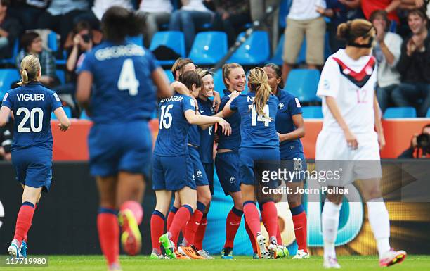 Gaetane Thiney of Francecelebrates with her team mates after scoring her team's first goal during the FIFA Women's World Cup 2011 Group A match...