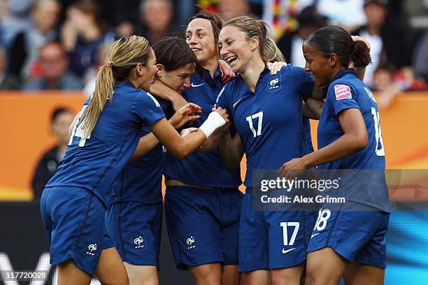 Gaetane Thiney of France celebrates her team's first goal with team mates during the FIFA Women's World Cup 2011 Group A match between Canada and...