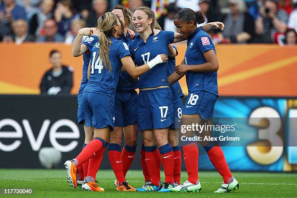 Gaetane Thiney of France celebrates her team's first goal with team mates during the FIFA Women's World Cup 2011 Group A match between Canada and...