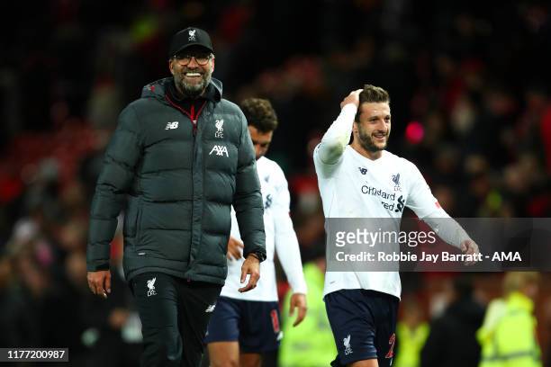 Liverpool manager / head coach Jurgen Klopp and Adam Lallana of Liverpool at full time the Premier League match between Manchester United and...