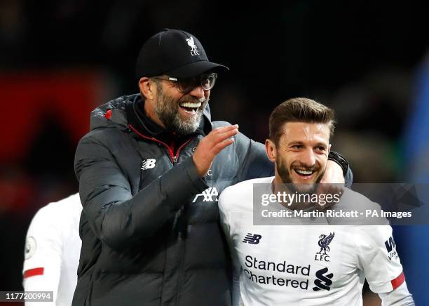 Liverpool manager Jurgen Klopp celebrates with Adam Lallana after the Premier League match at Old Trafford, Manchester.