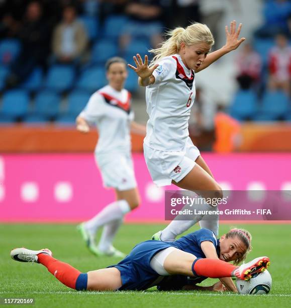 Camile Abily of France battles with Kaylyn Kyle of Canada during the FIFA Women's World Cup 2011 Group A match between Canada and France at the Fifa...