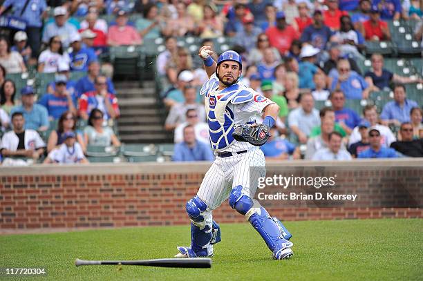 Catcher Geovany Soto of the Chicago Cubs throws to first base against the Colorado Rockies at Wrigley Field on June 27, 2011 in Chicago, Illinois....