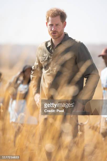 Prince Harry, Duke of Sussex during a tree planting event with local children, at the Chobe National Park, on September 26, 2019 in Kasane, Botswana....