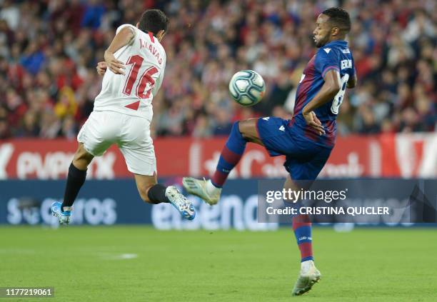 Sevilla's Spanish midfielder Jesus Navas vies with Levante's Portuguese forward Hernani Fortes during the Spanish league football match Sevilla FC vs...