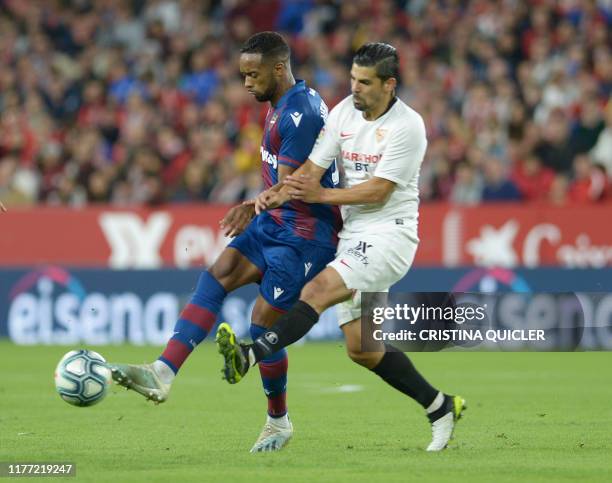 Levante's Portuguese forward Hernani Fortes fights for the ball with Sevilla's Spanish forward Nolito during the Spanish league football match...