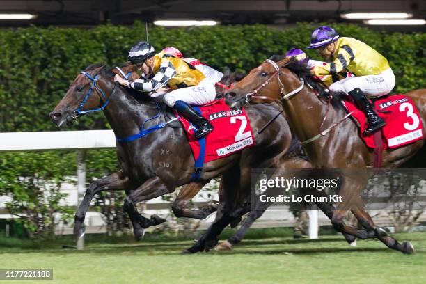 Jockey Chad Schofield riding Telecom Puma wins the Race 7 Community Chest Cup at Happy Valley Racecourse on September 25, 2019 in Hong Kong.