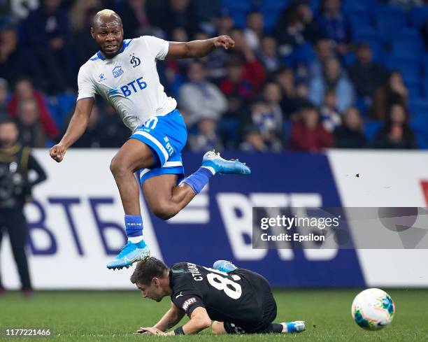 Sylvester Igboun of FC Dynamo Moscow and Dmitry Stotsky of FC Krasnodar vie for the ball during the Russian Premier League match between FC Dynamo...