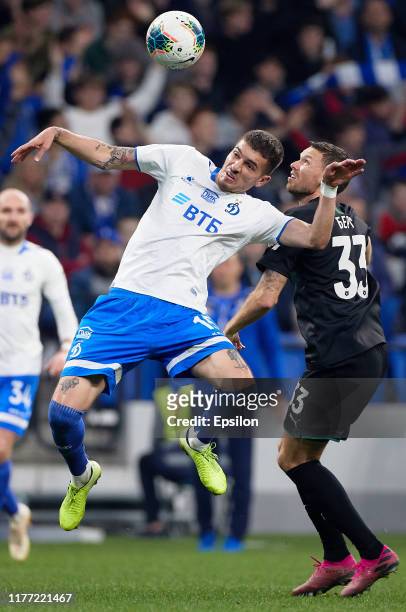 Roman Noyshtedter of FC Dynamo Moscow and Marcus Berg of FC Krasnodar vie for the ball during the Russian Premier League match between FC Dynamo...