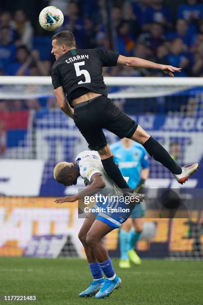 Sylvester Igboun of FC Dynamo Moscow and Uros Spajic of FC Krasnodar vie for the ball during the Russian Premier League match between FC Dynamo...