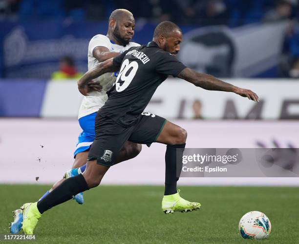 Sylvester Igboun of FC Dynamo Moscow and Manuel Fernandes of FC Krasnodar vie for the ball during the Russian Premier League match between FC Dynamo...