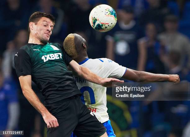 Sylvester Igboun of FC Dynamo Moscow and Ruslan Kambolov of FC Krasnodar vie for the ball during the Russian Premier League match between FC Dynamo...