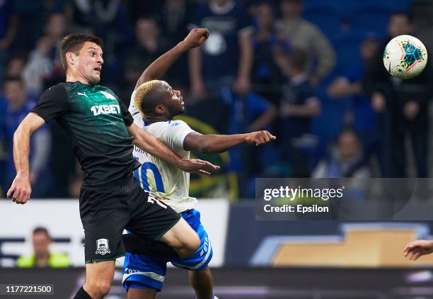 Sylvester Igboun of FC Dynamo Moscow and Ruslan Kambolov of FC Krasnodar vie for the ball during the Russian Premier League match between FC Dynamo...