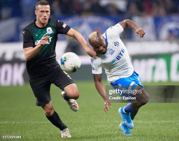 Sylvester Igboun of FC Dynamo Moscow and Uros Spajic of FC Krasnodar vie for the ball during the Russian Premier League match between FC Dynamo...