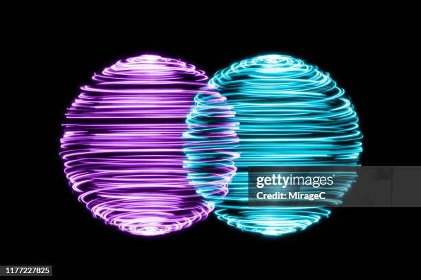 spinning light trails spheres intersection - dual stock pictures, royalty-free photos & images