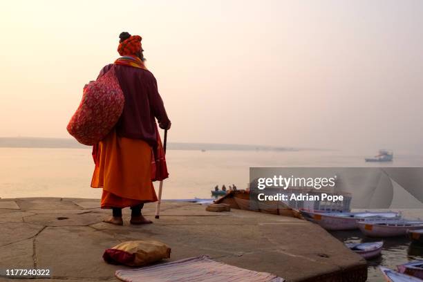 sahdu looking over the ganges in varanasi at dawn - sahdu stock pictures, royalty-free photos & images