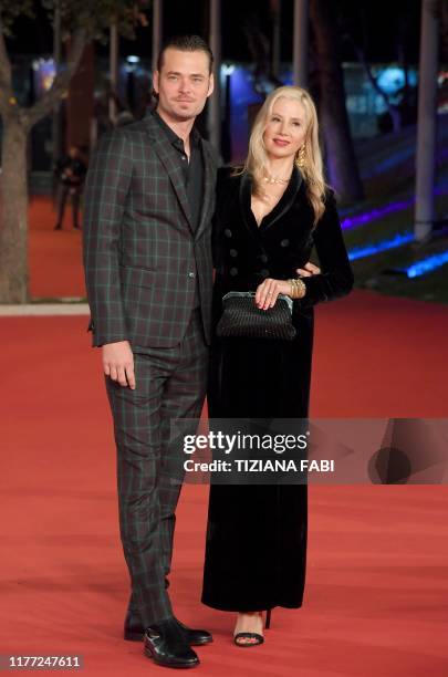 Actor Christopher Backus and US actress Mira Sorvino pose as they arrive for the screening of the film "Drowning" during the 14th Rome Film Festival...