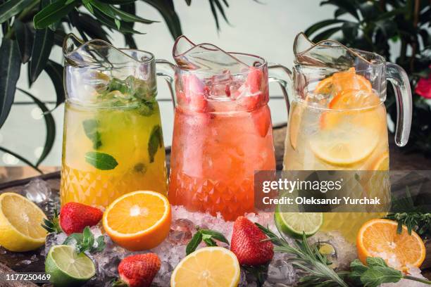 three different jugs of lemodane refreshing drink - jug stockfoto's en -beelden