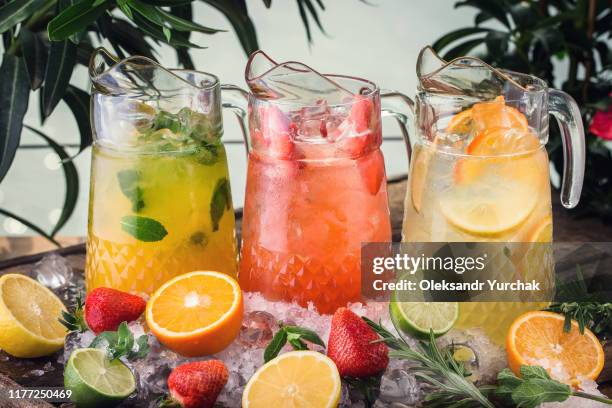 three different jugs of lemodane refreshing drink - iron wine stock pictures, royalty-free photos & images