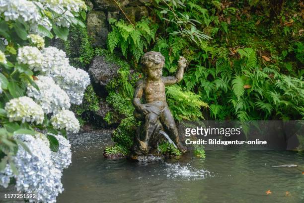 Cherub, fountain, Monte Palace Tropical Garden, Monte, Funchal, Madeira, Portugal.