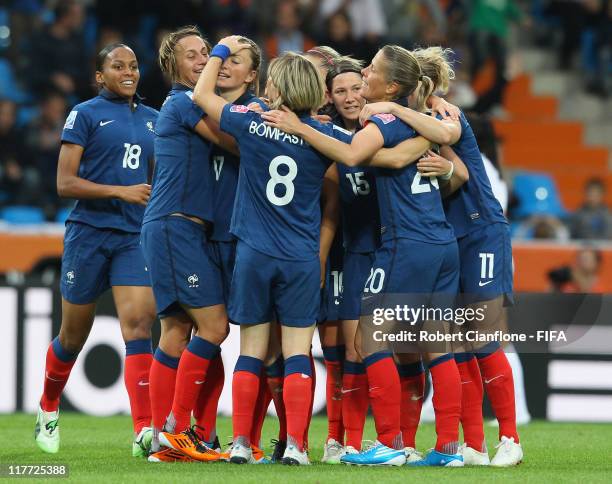 Gaetane Thiney of France celebrates her goal with team mates during the FIFA Women's World Cup 2011 Group A match between Canada and France at the...