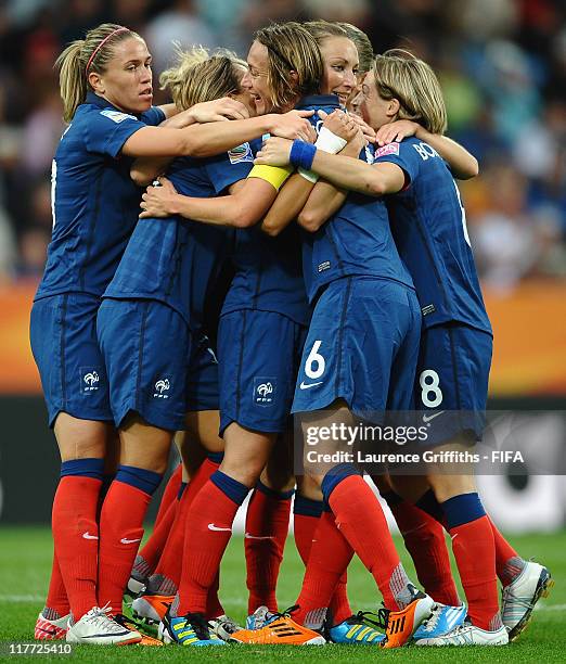 Gaetane Thiney of France is congratulated on scoring the second goal during the FIFA Women's World Cup 2011 Group A match between Canada and France...