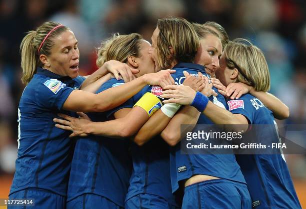Gaetane Thiney of France is congratulated on scoring the second goal during the FIFA Women's World Cup 2011 Group A match between Canada and France...