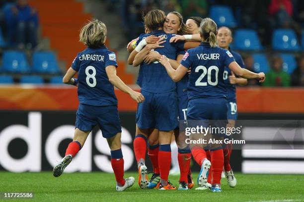 Gaetane Thiney of France celebrates her team's second goal with team mates during the FIFA Women's World Cup 2011 Group A match between Canada and...