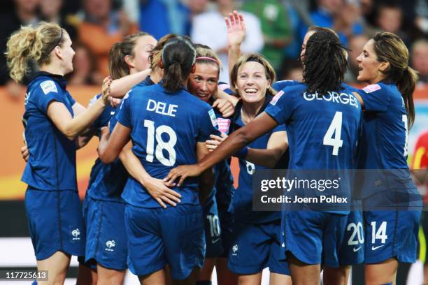 Camille Abily of France celebrates with her team mates after scoring her team's third goal during the FIFA Women's World Cup 2011 Group A match...