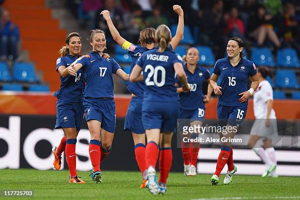 Gaetane Thiney of France celebrates her team's second goal with team mates during the FIFA Women's World Cup 2011 Group A match between Canada and...