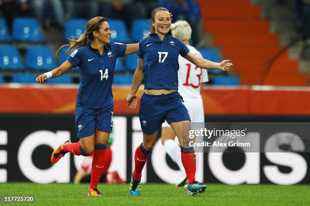 Gaetane Thiney of France celebrates her team's second goal with team mate Louisa Necib during the FIFA Women's World Cup 2011 Group A match between...